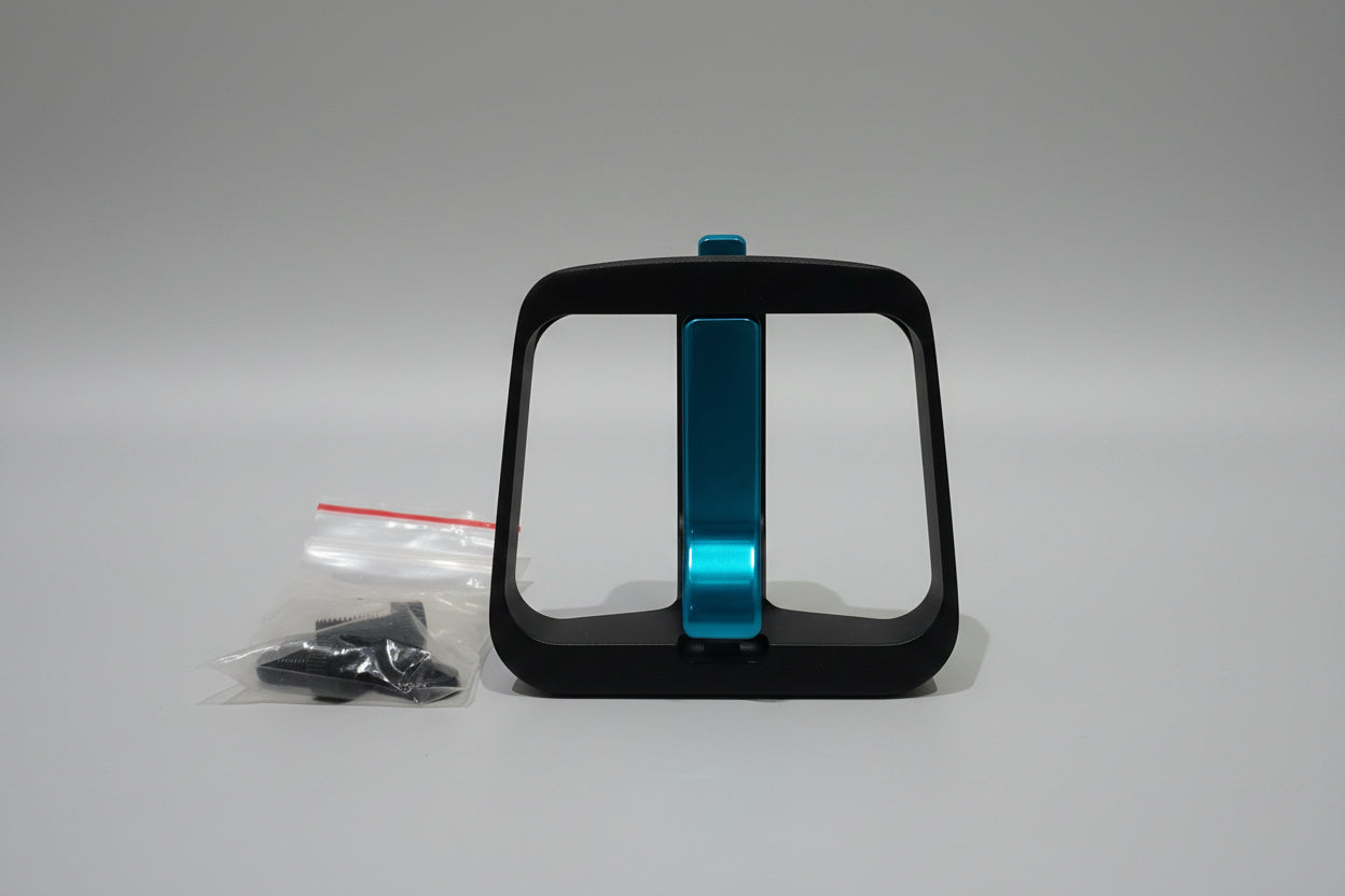 Black and blue bike water bottle holder on a wooden surface with a white background
